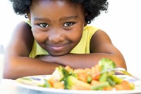 Girl and Plate of Vegetables